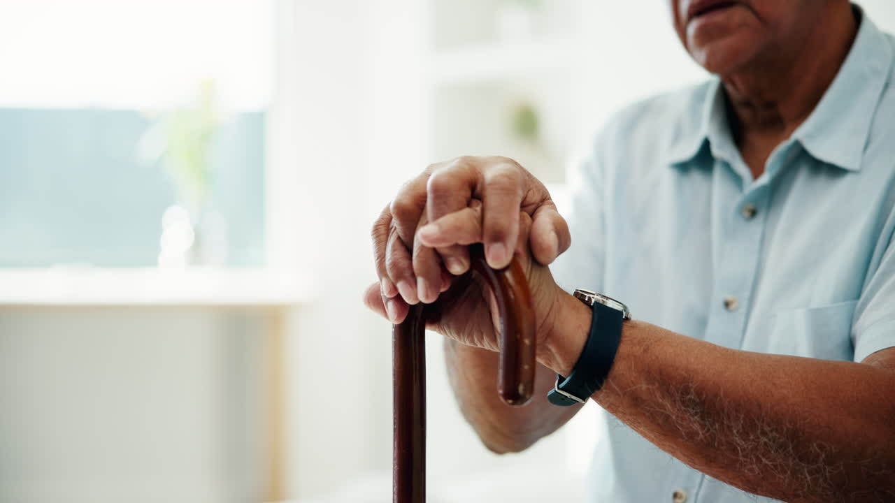 Senior man holding a cane