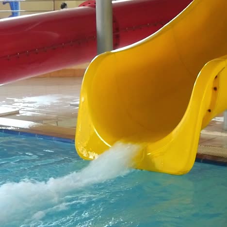 teen enjoying ride on water slide