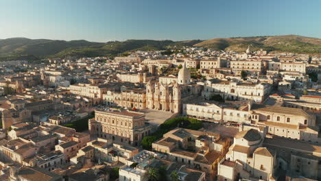 flying towards the noto cathedral on a sunny day in sicily, italy