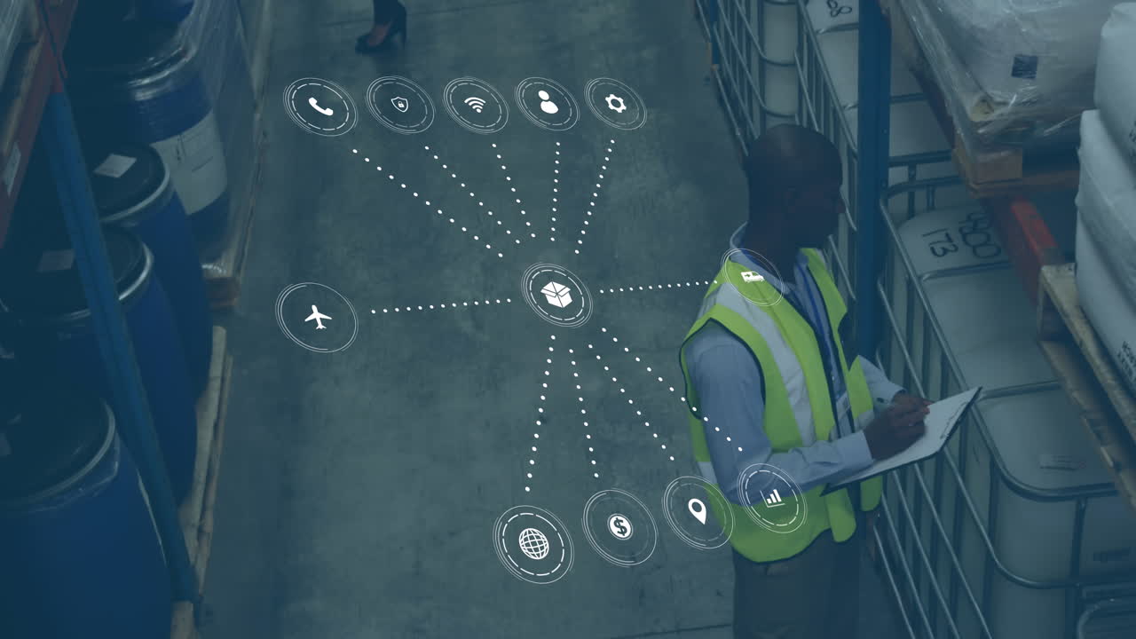 Animation of data processing with icons over african american man working in warehouse