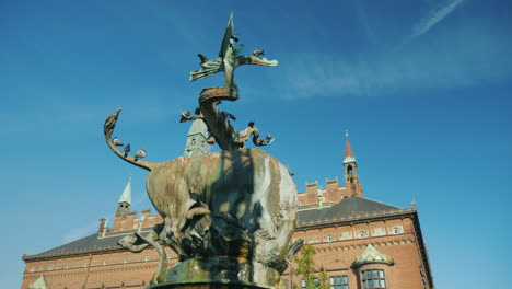 fountain bull tears a dragon in the center of copenhagen near the town hall 4k video