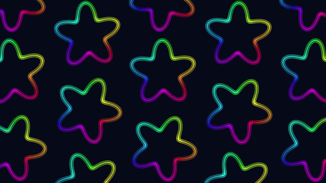 el patrón de estrellas de color arco iris flota en formación circular sobre un fondo negro.
