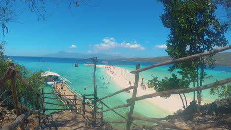 relaxing view of a beach with beautiful sandbar at sumilon island, cebu, philippines