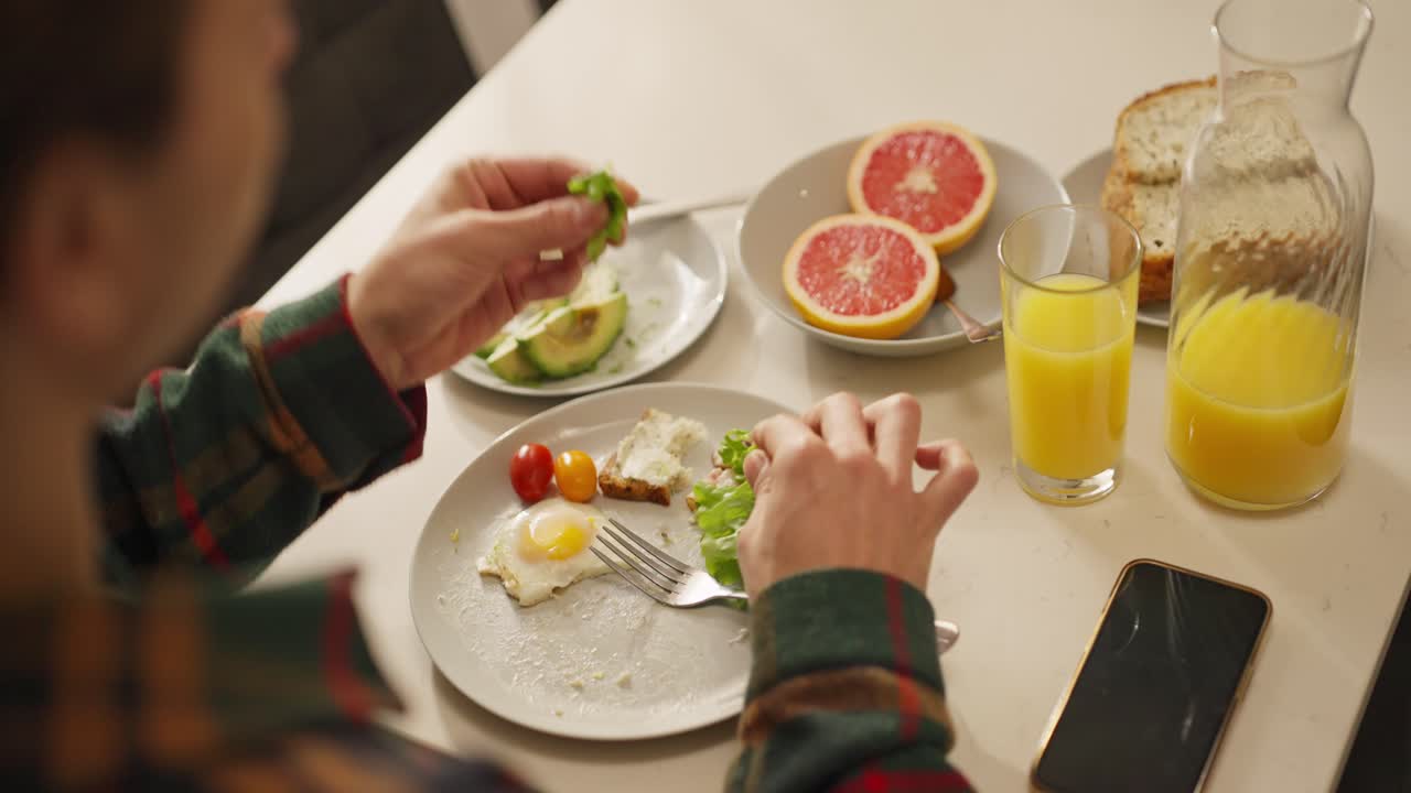 Healthy Breakfast with Orange Juice, Grapefruit, Egg, and Avocado