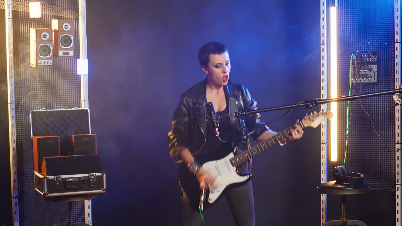 Woman playing guitar on stage
