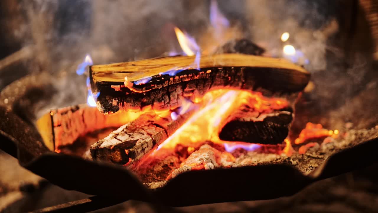 Cozy Riga Christmas market scene showing fire flames heating food in open air
