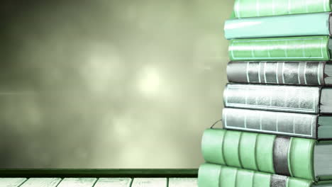 animación de una pila de libros con espacio de copia sobre luces verdes brillantes