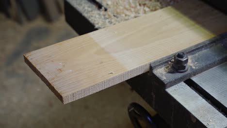 Wood-board-being-shredded-in-machine