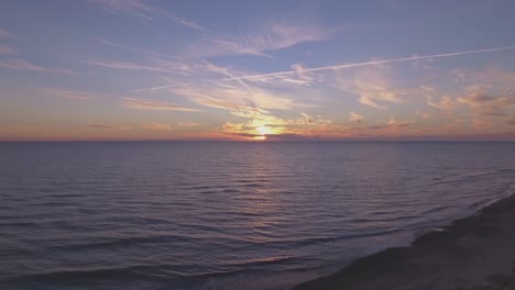 the waves of the baltic sea at sunset