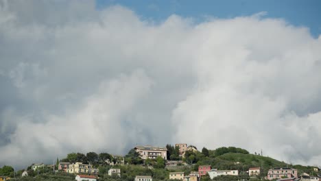 hillside town under a cloudy sky