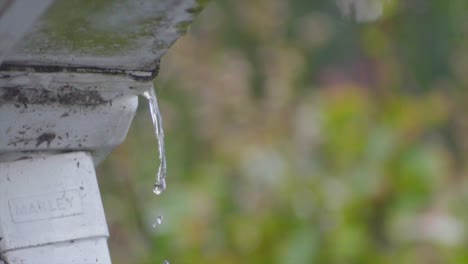 slow-motion-of-water-flowing-from-the-waterpipe-drainpipe-out-the-house