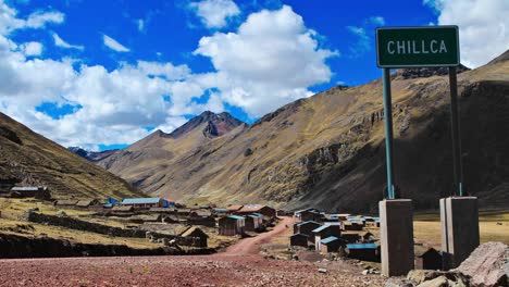 Chillka-village-sign-with-village-in-back-ground