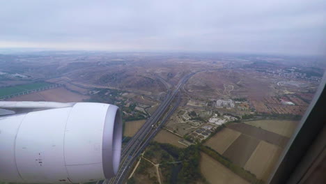 pov view from airplane over spain nearing madrid