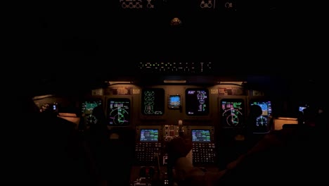 jet cockpit view in a real flight though stormy clouds with turbulence and lightnings, night light