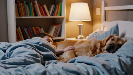 a golden retriever and child on a cozy bed