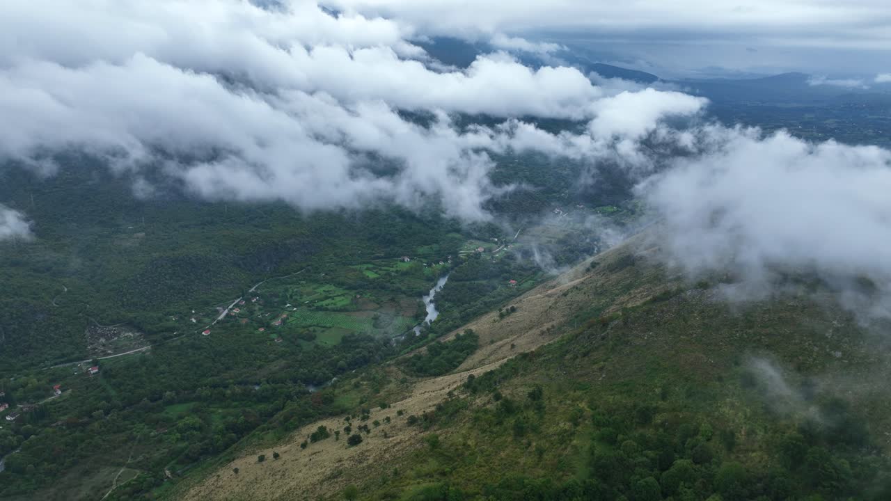 Green Misty Valley Landscape with Low Level Clouds Aerial View
