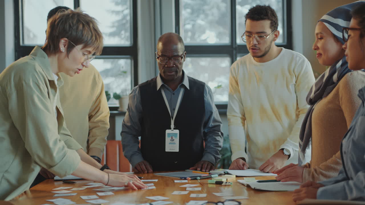 Immigrant Students and Senior Teacher Discussing Word Cards on Lesson
