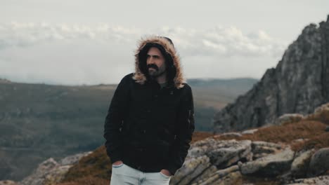 motivated handsome man with a mustache takes in the beauty of nature