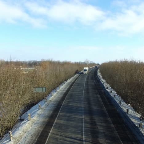 asphalt road in snowy winter