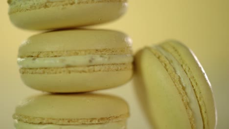 two cookies macaroons are stacked on top of each other