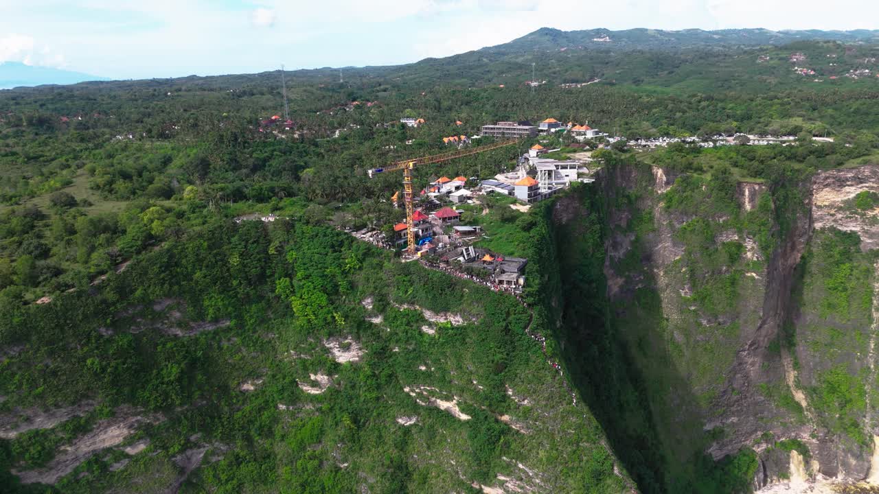 Viewpoint full of people and small township near Kelingking beach, aeria lview