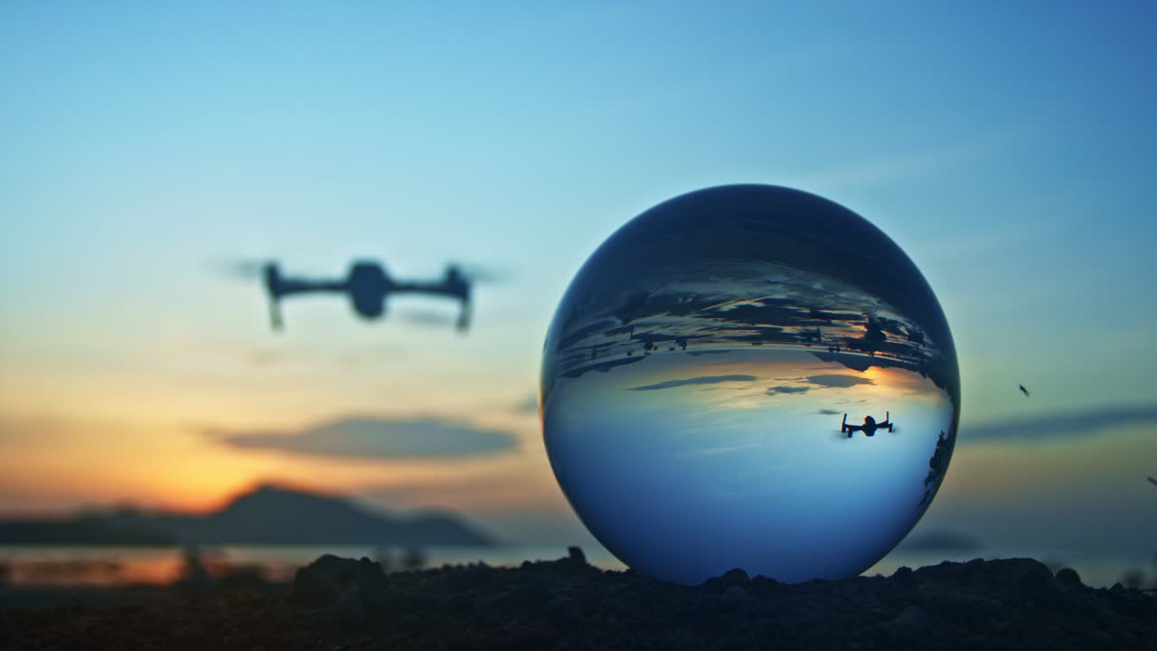 Drone flying in front the Crystal ball in twilight.