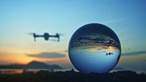 drone flying in front the crystal ball in twilight.