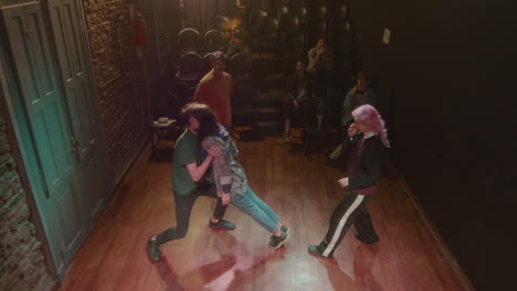 actors doing trust falls during class with stage director in a theater