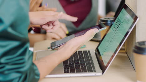 hands, laptop and phone of team in collaboration