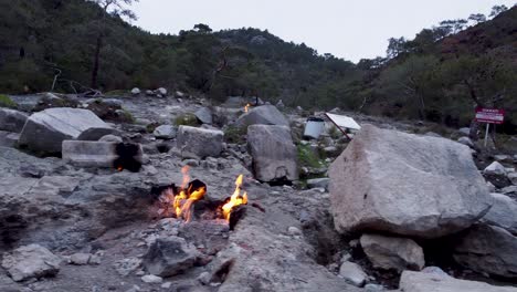 eternal flames: natural gas burning out of stone rocks at mount chimaera, turkey