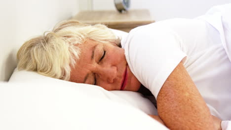 Mature-woman-being-a-restless-sleeper