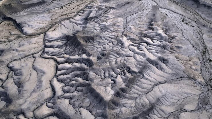 Concept outer space inhabitable planet from another galaxy, vast grey landscape