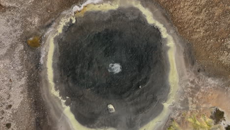 boiling basin of water iceland hveravellir geothermal pool aerial shot