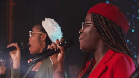 female choir singing on stage