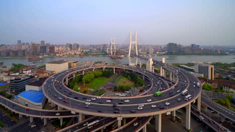 time lapse of aerial view of nanpu bridge, shanghai downtown, china. financial district and business centers in smart city in asia. top view of skyscraper and high-rise buildings at sunset.