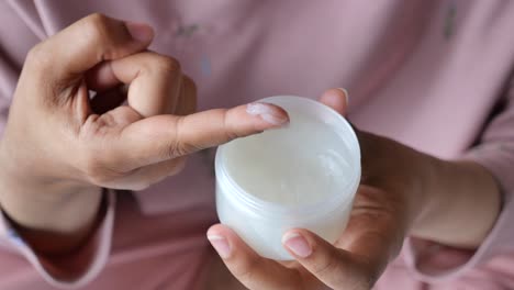 woman applying face cream