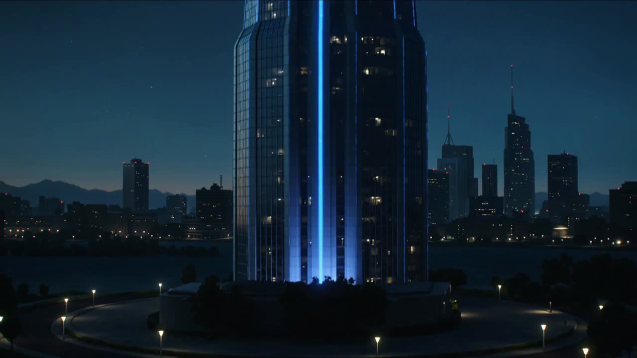 Lighting sequence starting, glass tower lighting up with blue strips outlining crown at waterfront