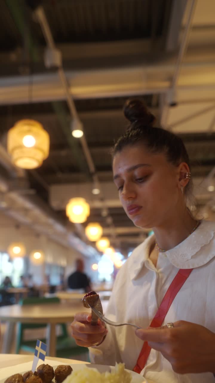 Woman Eating Swedish Meatballs