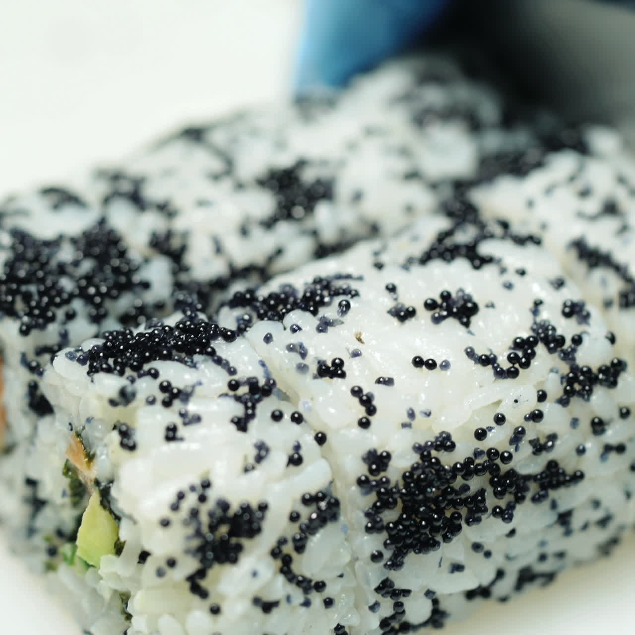 Chef in restaurant preparing and Cutting sushi rolls Sqare video