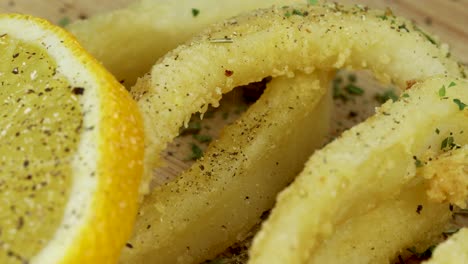 Macro-shot-of-adding-pepper-to-fried-squid-rings