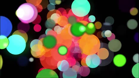 Animation-of-colourful-bokeh-circles-of-light-floating-on-black-background,-filling-screen