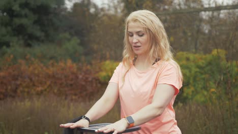 athletic woman exercises using resistance stepper mid shot