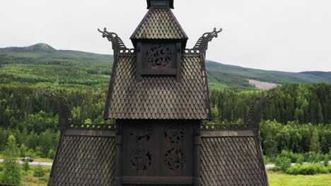 top roof detail of the old borgund stave church in laerdal municipality, vestland county, norway - close up - ascending drone shot