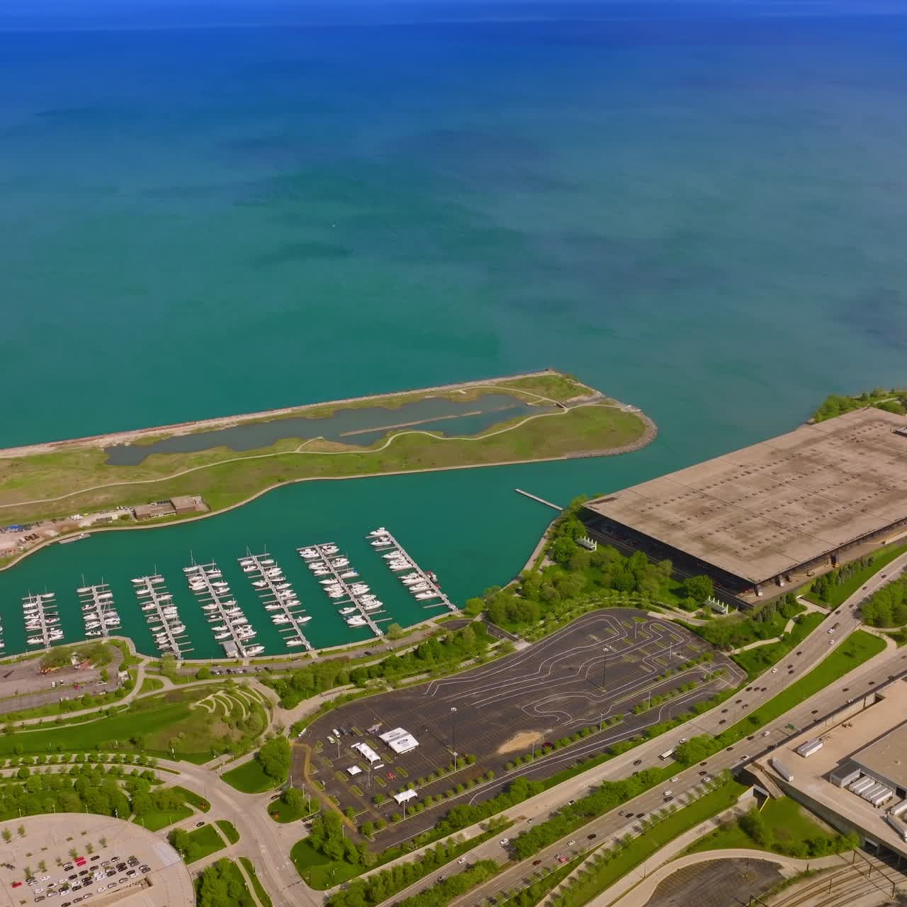 Eye-catching site of the terrific Lake Michigan waterfront. Green park zones and yacht club at the backdrop of turquoise waters