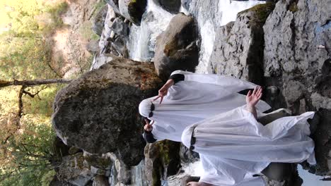 two people dance doing a social media trend dressed as ghosts