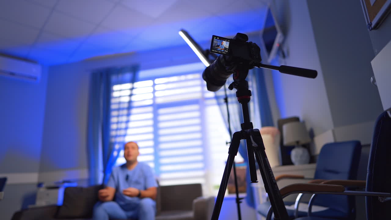 Kyiv, Ukraine, 2 May 2025: Modern camera on tripod set indoors. Low angle view. Footage of a vlogger creating content. Selective focus