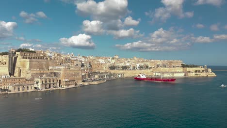 Aerial-shot-over-water-and-towards-old-city-surrounded-with-sea