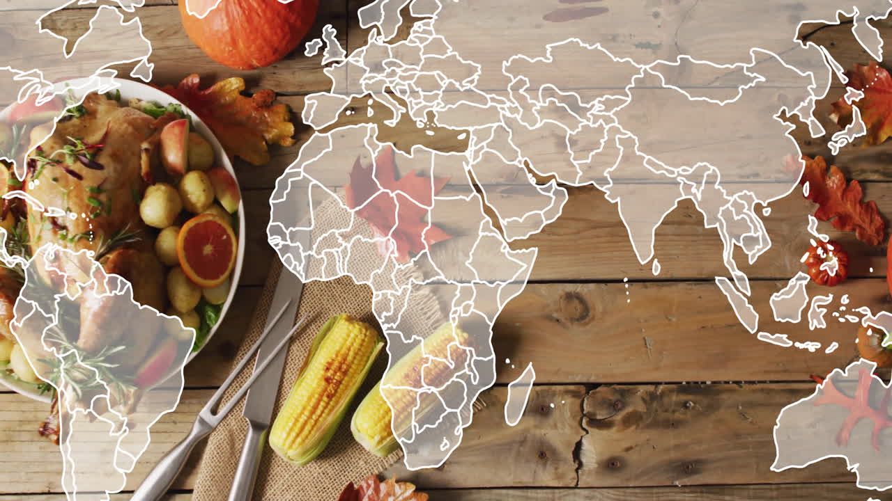 Thanksgiving meal with corn and autumn leaves over world map animation on table