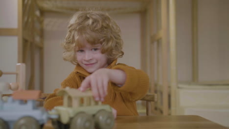 little boy playing with eco toy