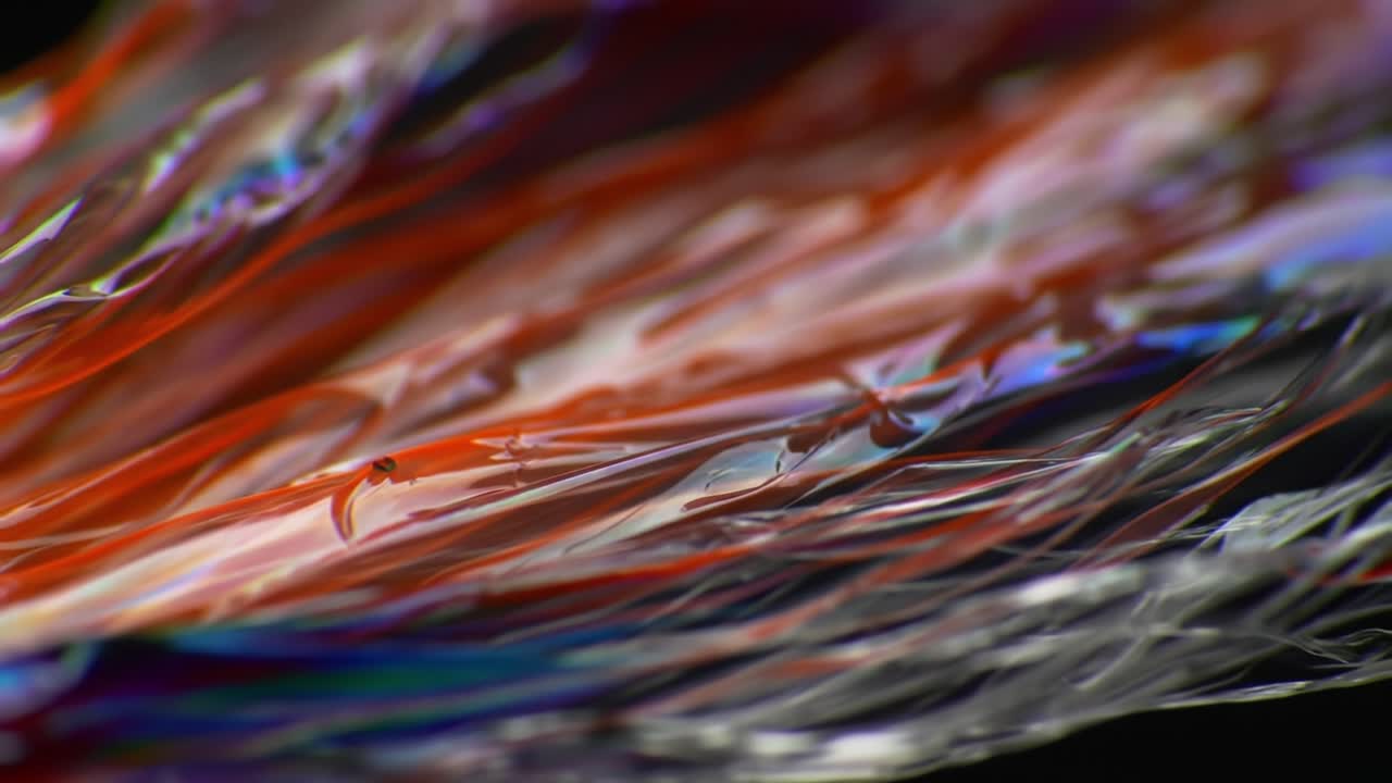 Captivating Wave Patterns of Orange and Silver Fluid Dynamics in Motion